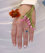 Anillo topacio azul oro blanco 14K