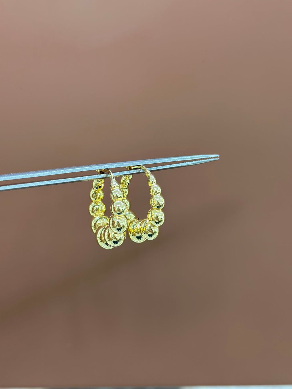 Arracadas bolas huecas 14K