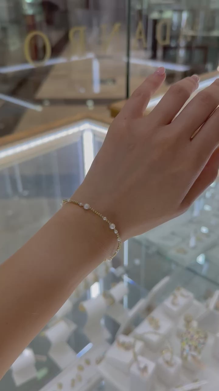 Pulsera perlas blancas y bolitas oro 14K