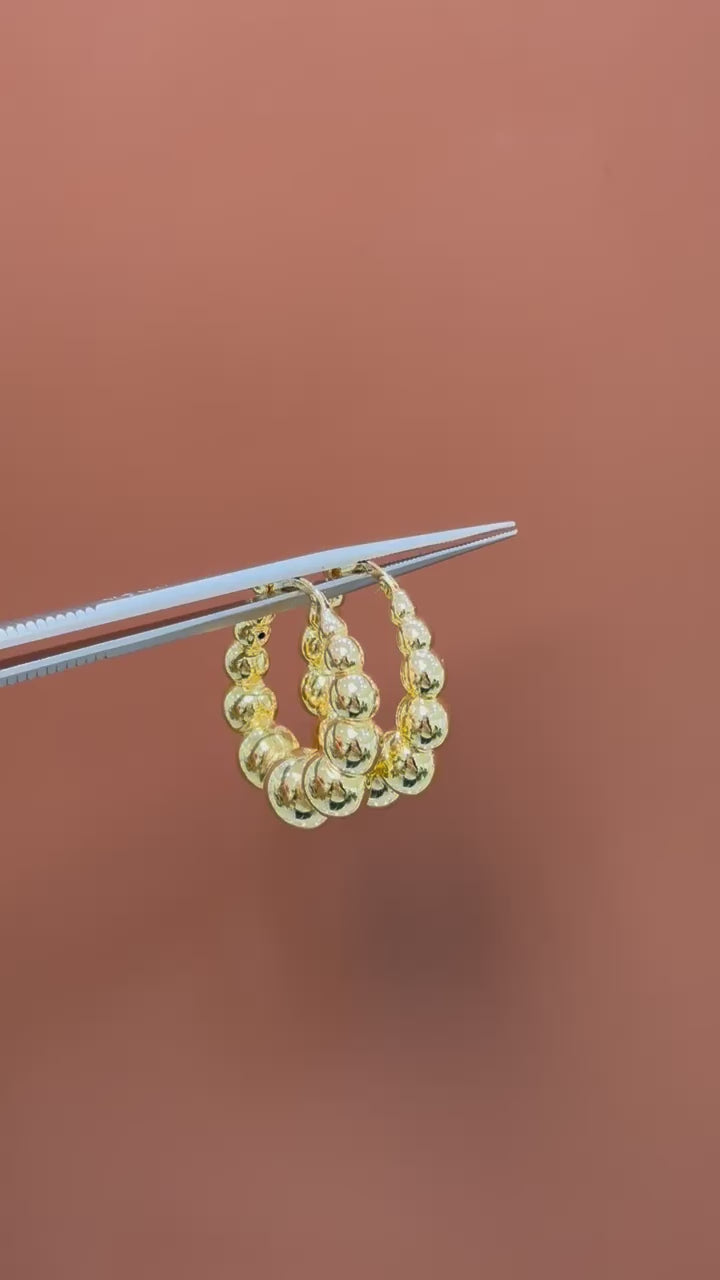 Arracadas bolas huecas 14K