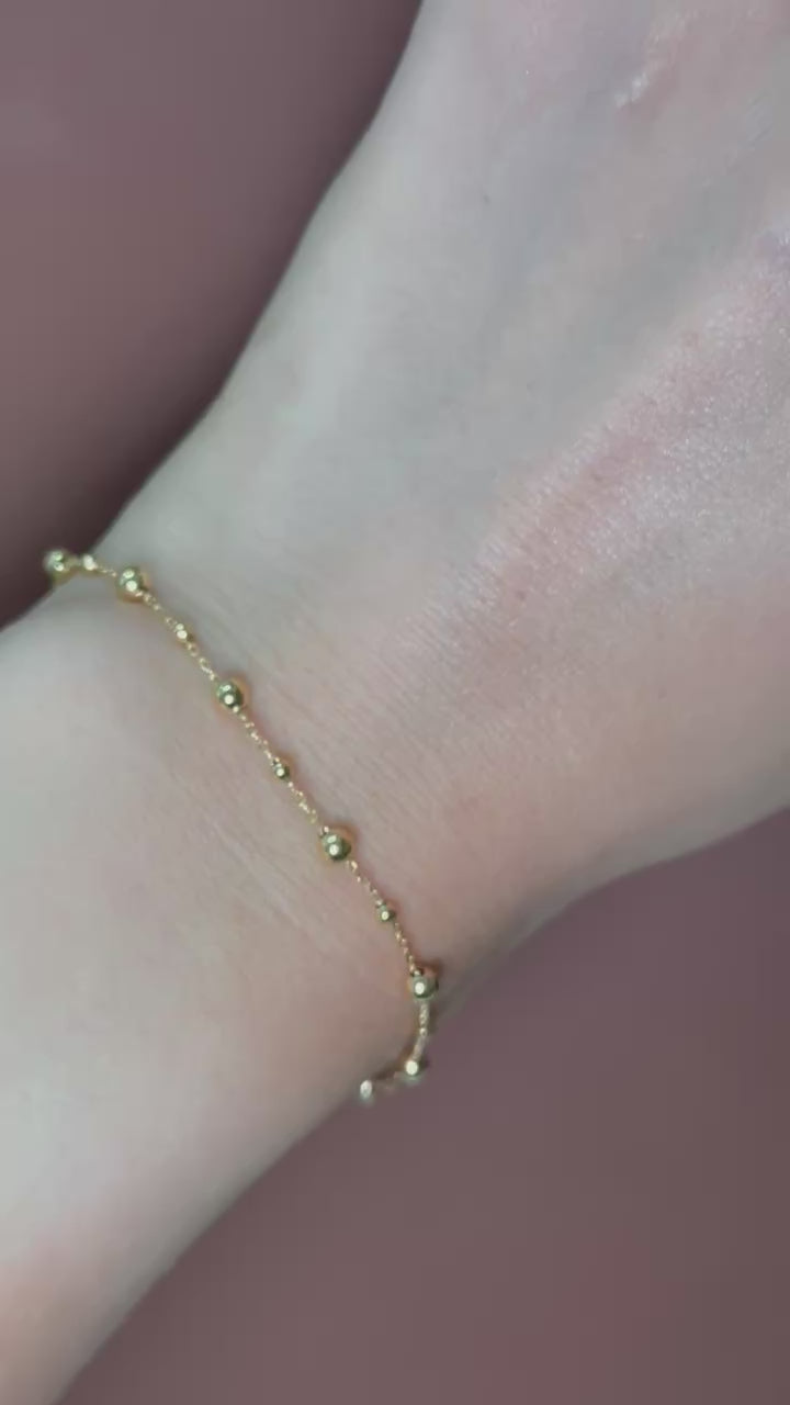 Pulsera bolitas lisas 14K