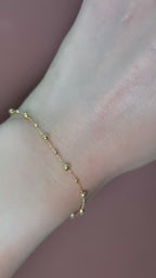 Pulsera bolitas lisas 14K